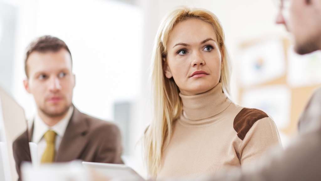 a trio of people meet for business purposes